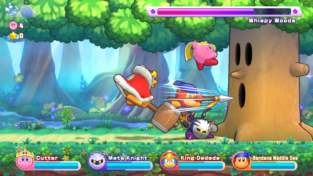 Screenshot showing a boss battle being played by four players in Kirby's Return to Dream Land Deluxe
